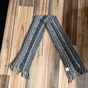 Multi-colored lightweight knit scarf.